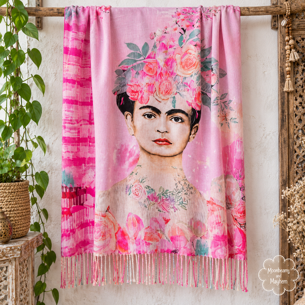 Full pink Frida Kahlo scarf displayed open to show the floral portrait and tasselled edge