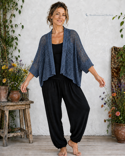 Woman wearing the Moonlit Tide petrol blue waterfall kimono with black harem trousers