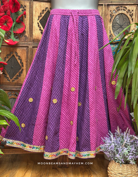 Pink and purple striped Stargazer maxi skirt with golden flowers and a multicoloured mirrorwork hem