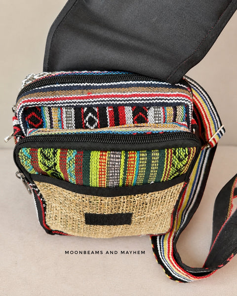 Blue Mix crossbody bag open to show its zipped compartments
