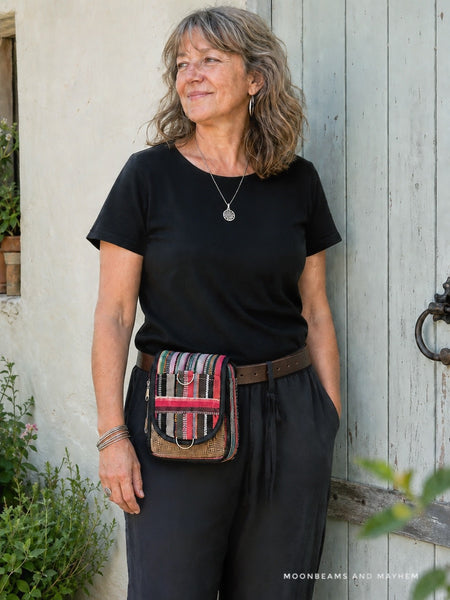 Woman wearing the Wandering Spirit patchwork bag around her waist